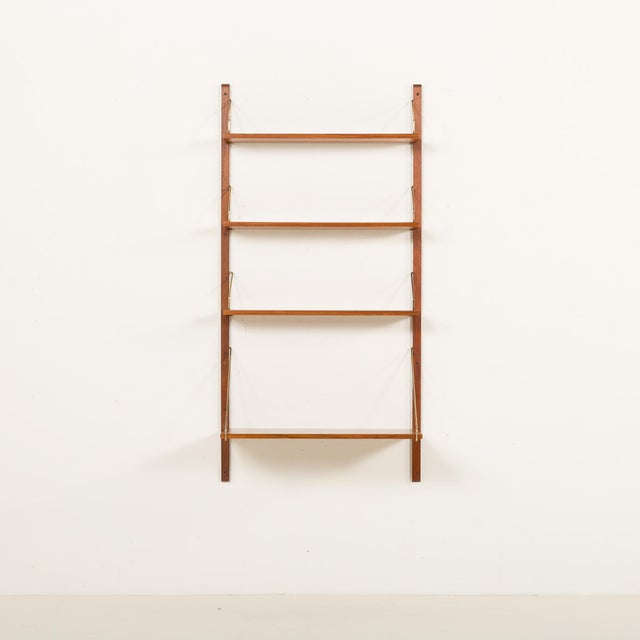 The danish home office teak shelving unit with a desk shelf was designed by poul cadovius and manufactured by cado in the...