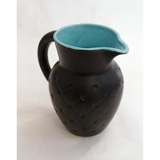 Mid-century "Resille" pitcher by Poet Laval, France; stylized shape, body decorated with a latticework pattern, curved...