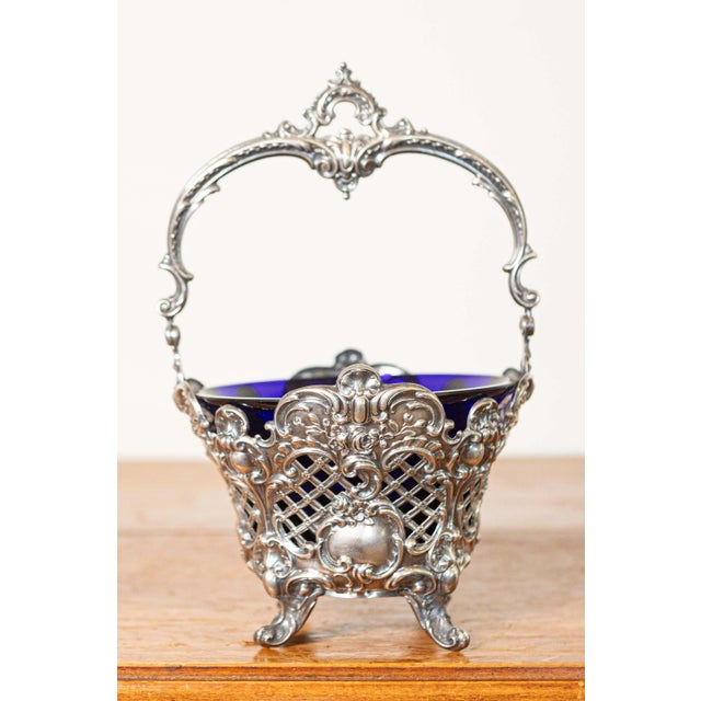 This exquisite 19th Century French basket is a testament to the opulence and intricate craftsmanship of the era. The...