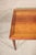 Danish made dining table in rich rosewood grain. Two leaves hide underneath the table top and are easily pulled out to...