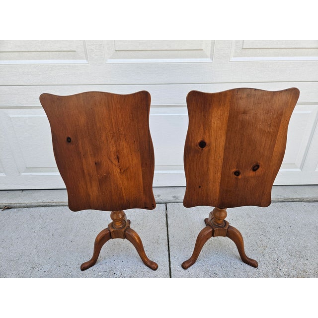 A pair petite or diminutive flip top side tables. The tabletop on each table is 12 inches wide by 16 inches in depth. With...