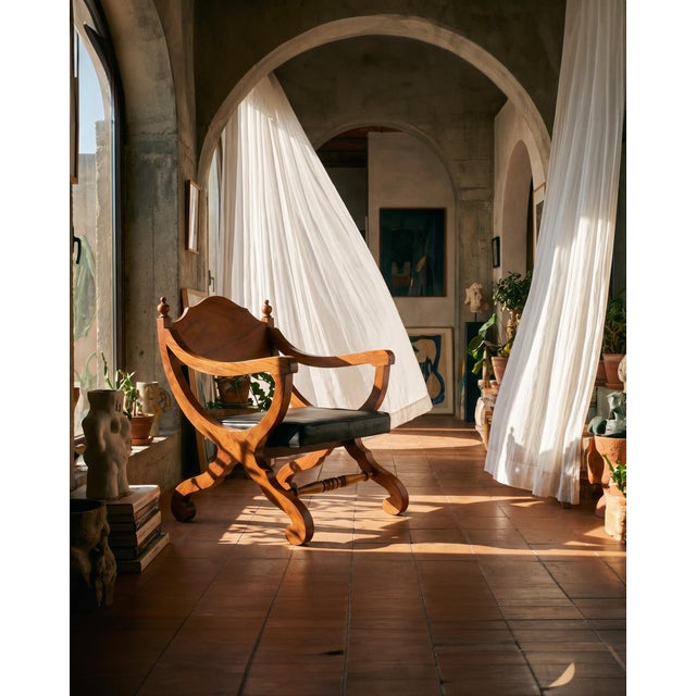 Exuding an air of dignified elegance, this pair of Mexican Campeche chairs blend traditional craftsmanship and rich...
