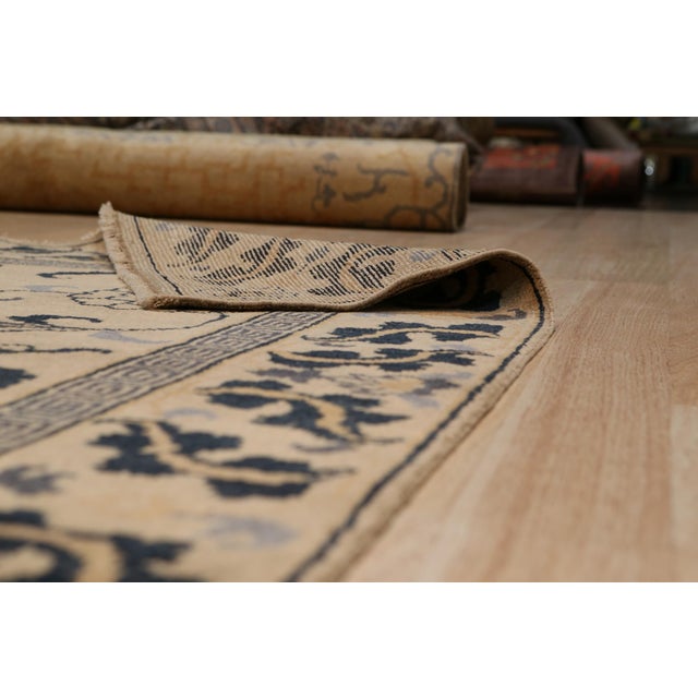 Willow Lydia Gold Hand Knotted Wool Rug, Country of Origin: China. This exquisite piece presents a refined transitional...