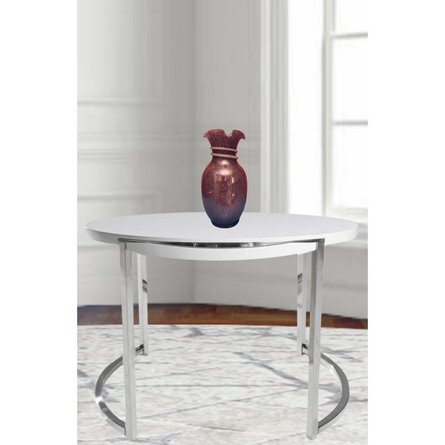 This exquisite 13-inch-tall art glass vase is a stunning example of handblown craftsmanship. The vase is made from both...