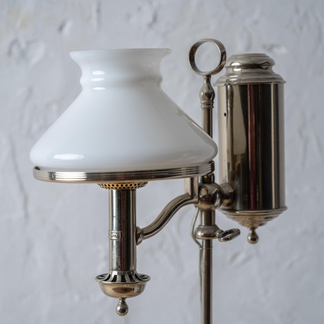 A nickel plated electrified student lamp by Stobwasser, Berlin, circa 1880. 10 ¼ inches wide by 6 ½ inches deep by 21 ¼...