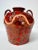 Large vintage studio pottery vase with two loop handles, a flared neck, and a heavily worked surface. Glossy brown and...