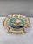 Square Majolica mermaid plate with shells on the corners, the mermaid sit on a flying fish, the border is decorated with...