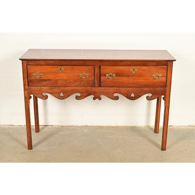 A gorgeous Georgian or Chippendale style sideboard buffet, credenza, or console table In the manner of Baker Furniture By...