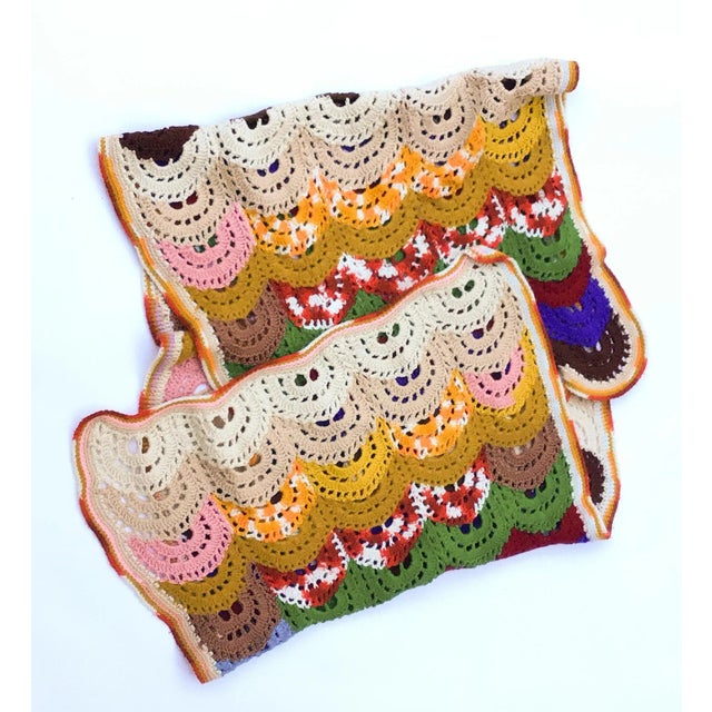 Beautiful and colorful crocheted blanket with scalloped design. This piece has been lovingly stored away for decades in a...