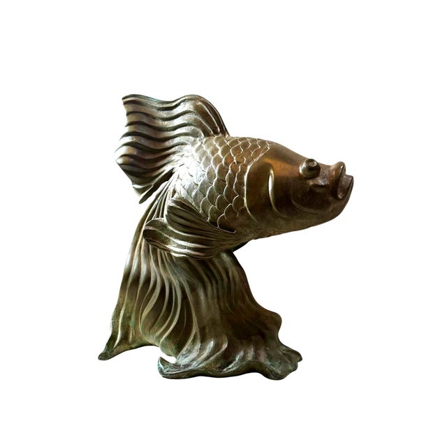 A striking vintage bronze sculpture depicting a graceful fantail goldfish with beautifully flowing fins and exceptional...