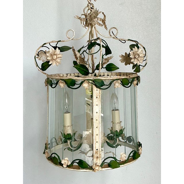 This enchanting vintage toleware lantern is a masterclass in French Country elegance, featuring a charming botanical...