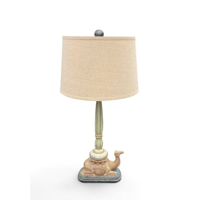Moorish, safari-inspired ceramic table lamp depicting a camel in repose in muted, matte colors. Shade not included. Height...