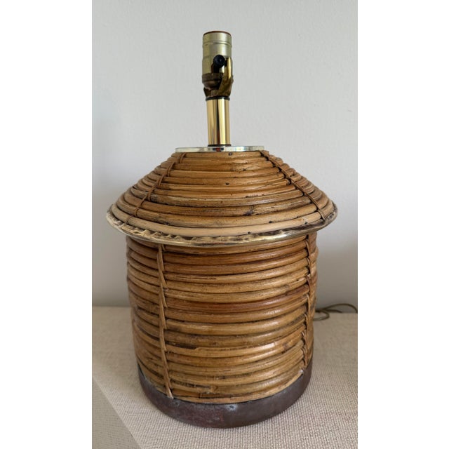 Gorgeous Vintage Hollywood Regency Pencil Reed Rattan Table Lamb with Brass around the center and bottom in the style of...