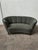: Two-seater sofa with a curved and elegant design. – Fabric upholstery. – Wooden frame. – Wooden legs. Dimensions: Length...