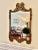 Beautiful vintage ornate metal and composite gilt mirror with beveled glass and aged brass patina. Scroll and leaf detail...