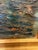 This oil painting is a seascape oil painting depicting sailboats gliding across calm canal waters beneath a clear sky. The...