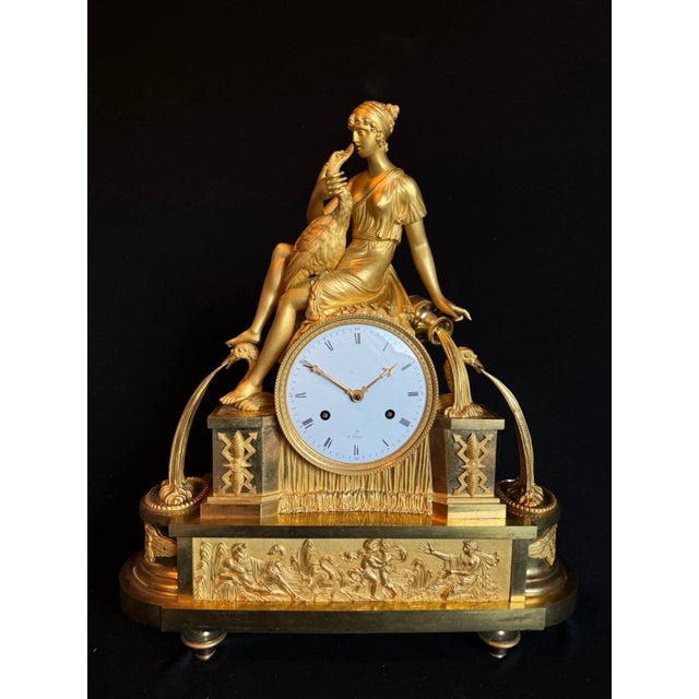 This exceptional circa 1800 French Empire mantel clock is a richly sculptural example of early 19th-century French...