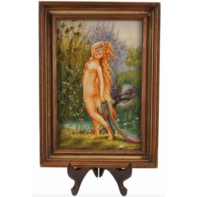 A fine and exceptionally painted KPM style porcelain plaque, depicting river scene with standing nude nymph, holding...