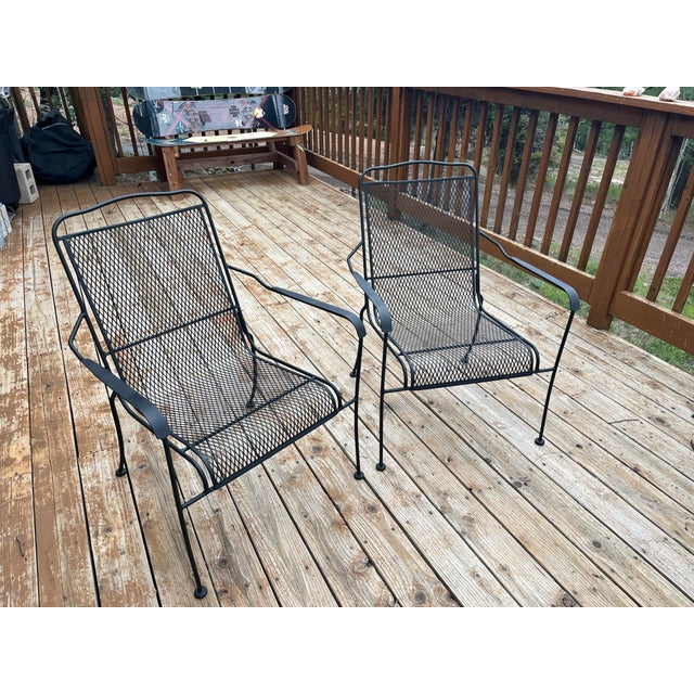 Crafted in the iconic style of prominent mid-century makers like Woodard and Meadowcraft, these chairs feature a sturdy,...