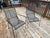 Crafted in the iconic style of prominent mid-century makers like Woodard and Meadowcraft, these chairs feature a sturdy,...