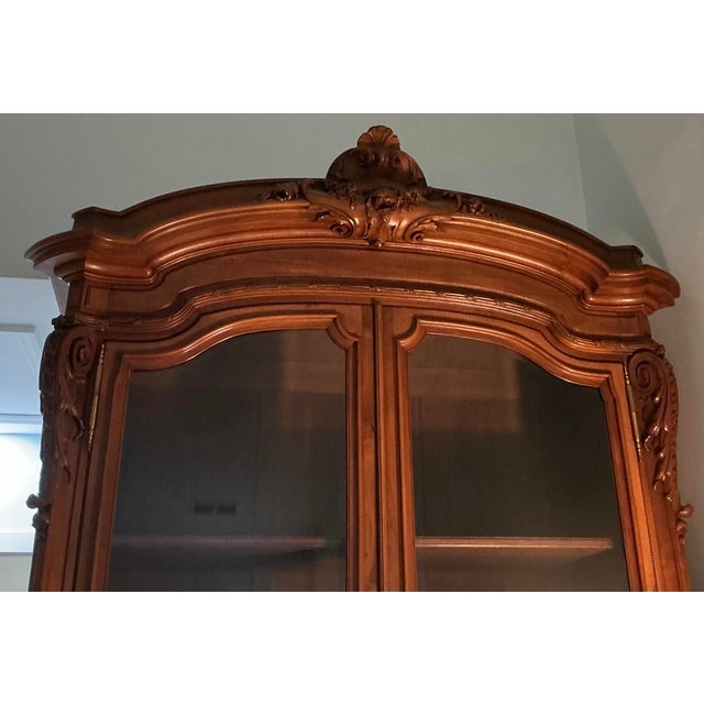 Antique King Louis cabinet. Circa 1890s. Solid walnut, beveled glass.