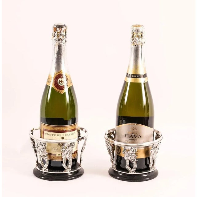 A superb pair of antique Regency Revival silver plated wine coasters circa 1900 in date. They feature pierced sides...