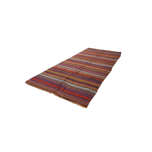 Handwoven vintage striped decorative kilim rug from Denizli region of Turkey. Approximately 50-60 years old. In very good...