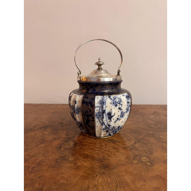 Pretty antique Doulton Burslem biscuit barrel, having a quality antique Doulton Burslem biscuit barrel with a shaped body...