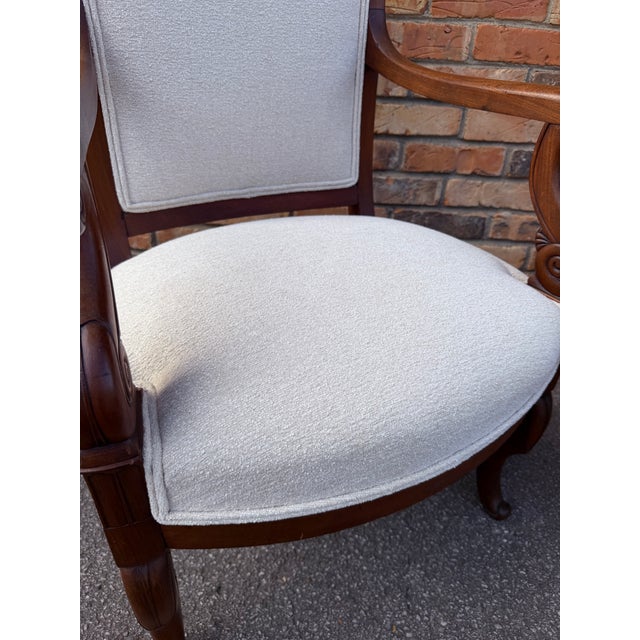 There are a lovely pair of French Restoration Charles X armchairs newly upholstered in classic antique white fabric. They...
