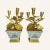 These candelabra are comprised of early Qing ducai porcelain pots with geranium gilt bronze inserts and simple bases. The...