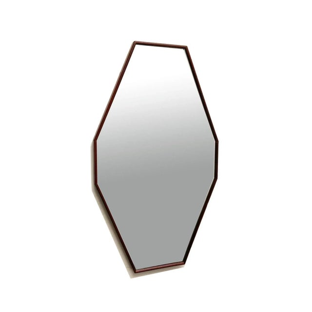 Italian mirror from the 1960s, with an elongated octagonal shape. Teak frame, original silver mirror. Very good condition....