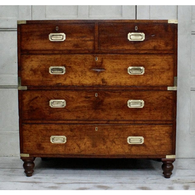 A superb quality teak military campaign chest. Made from teak, the drawers split into two halves, the top section with two...