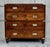A superb quality teak military campaign chest. Made from teak, the drawers split into two halves, the top section with two...