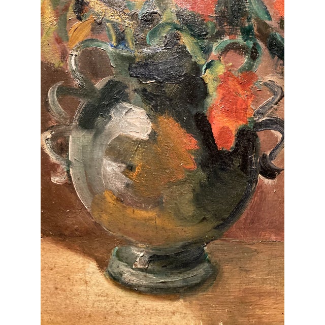 Lovely mid-century french oil on board painting of orange flowers in a vase. Presented in a simple provincial-style wood...