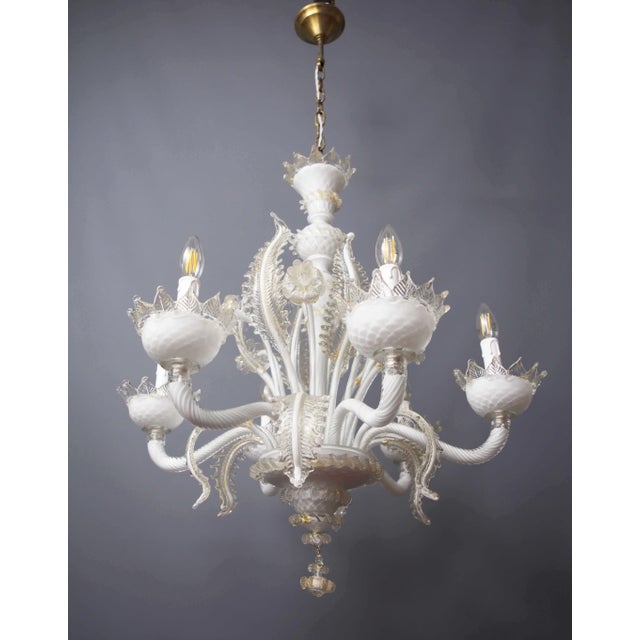 An impressive venetian chandelier made of murano glass, made in a combination of white opal glass and clear glass with...