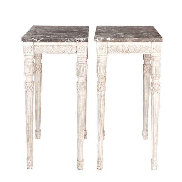 Pair of unusually small pair of carved & painted Gustavian hardwood console tables with original gray and white Saint Anne...