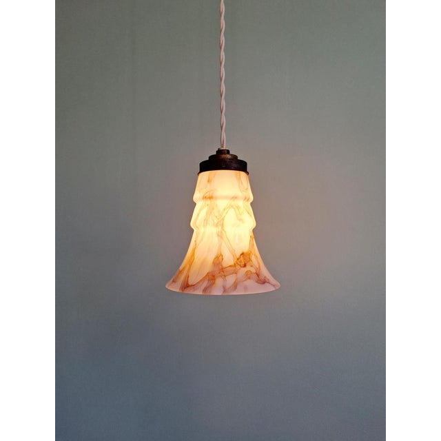 Art Deco bell-shaped pink marbled opaline suspension produced in the 1920s-30s at the Scailmont glassworks (Manage,...