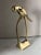 Polished and lacquered brass bird sculpture in excellent condition.