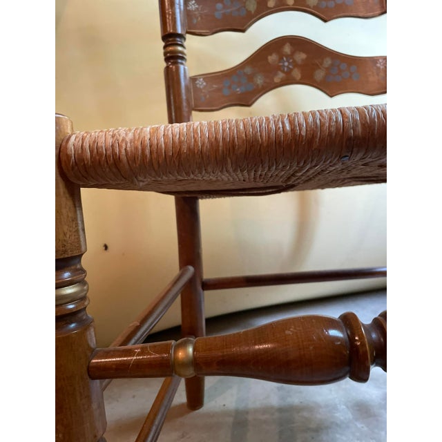 Solid maple with a warm nutmeg stain, this ladderback side chair from Ethan Allen’s Heirloom Collection channels early...