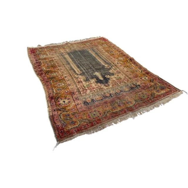 Step into a world of timeless elegance as you uncover the exquisite beauty of our Antique Armenian Silk Rug, a precious...