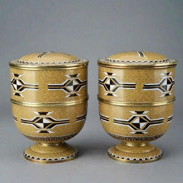 This is a matching pair of elegant, large-scale lidded jars, crafted in the traditional cloisonné enamel technique on a...