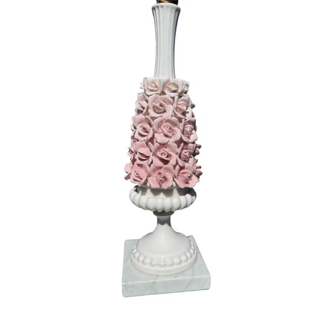 Vintage Italian lamp with tiny porcelain roses sets on a marble base. Lamp measures 23.5” to the top of the finial, 16” to...