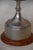 A proper two-handled silver cup on a turned wooden base engraved with a winners' inscription and carrying the unpolished...