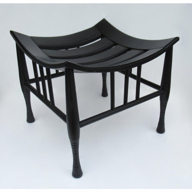 Early C.1920's; Liberty & Co. attributed, Egyptian-Revival, Anglo-Indian, English Thebes stool, in an ebony satin stain...