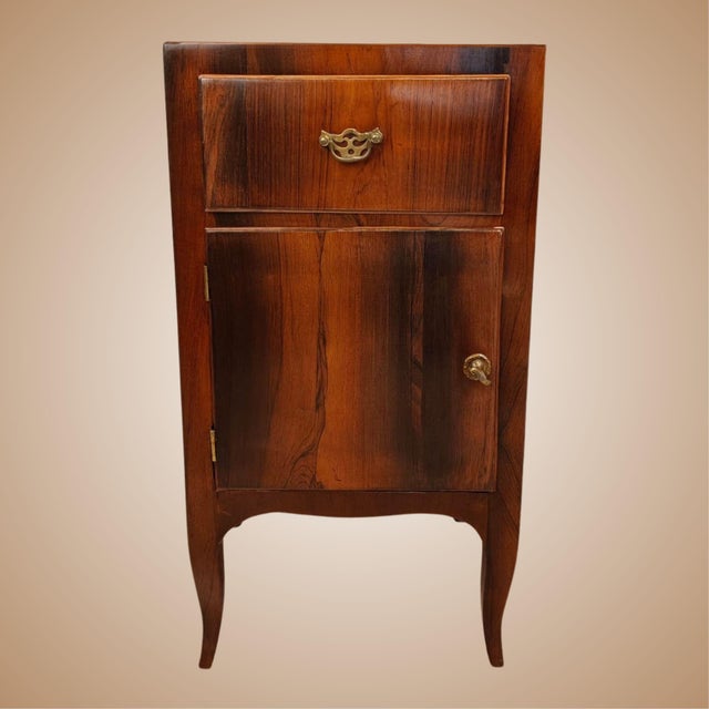 A pair of Venetian bedside tables, dating from the late 18th to the early 19th century, made of rosewood veneer with a fir...