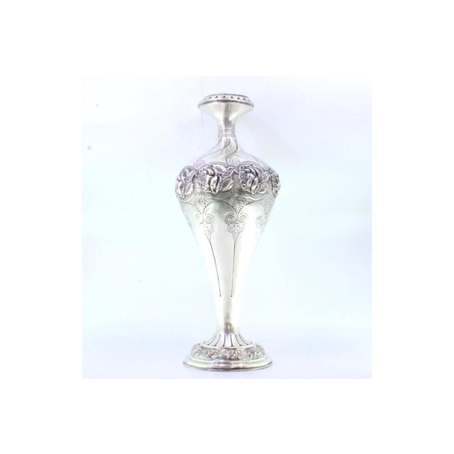 Silver Vase with Foral Motifs and Edge Frills, in Very Good conditions. Designed 1890 to 1919 This piece has an...
