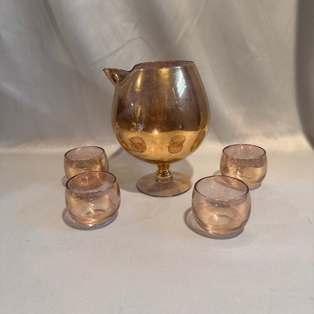 A vintage gold gleck cocktail martini pitcher and 4 roly poly glasses perfect addition to your vintage barware collection....