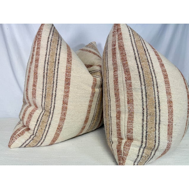Custom pair of 22" pillows covered in a super soft wool/linen blend striped fabric in cream, brown, rust and golden beige....