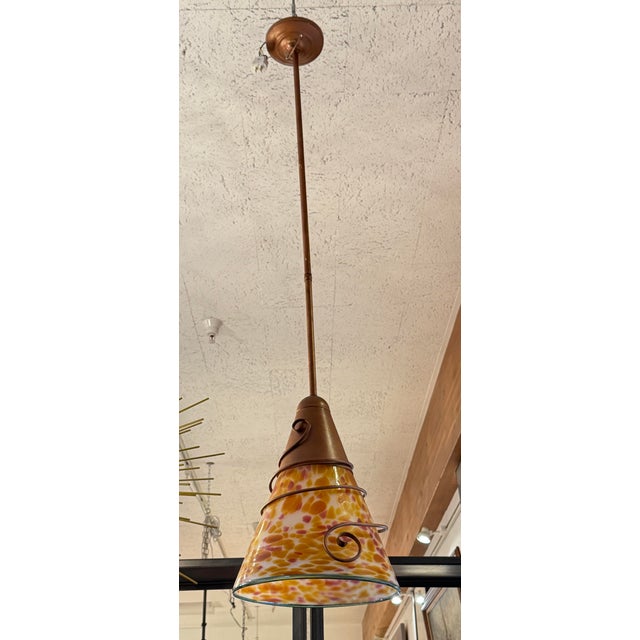 Design Plus Gallery presents an Art Nouveau Art Glass + Copper Pendant Light. The pendant showcases a flared art glass...