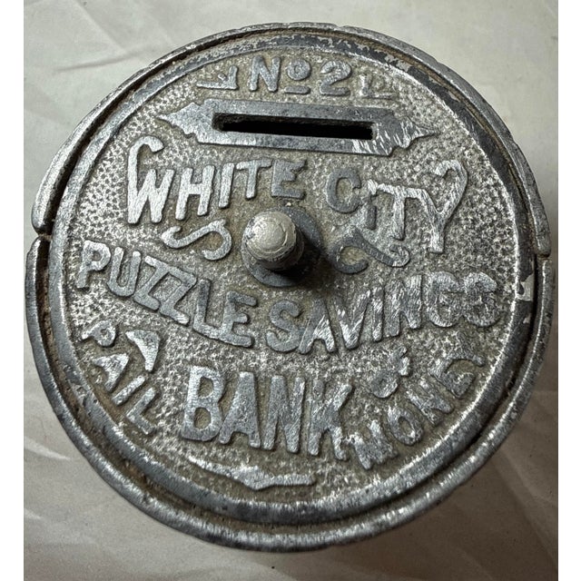 Up for sale is a wonderful antique late 19th century cast Iron White City Puzzle Savings #2 still bank. It is a unique and...